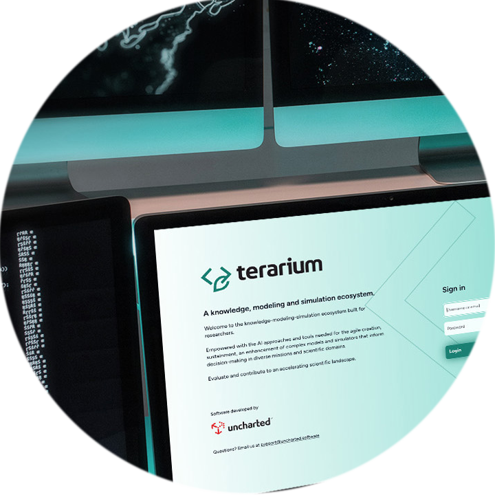 Multiple monitor display showing the Terarium login page and workflow editor on separate screens